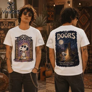 Man wearing white t-shirt featuring Snoopy as Jim Morrison on front and starry desert landscape on back with The Doors text.!