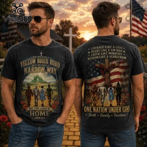 Vintage black t-shirt featuring Wizard of Oz characters walking on yellow brick road with American flag and cross graphics.!