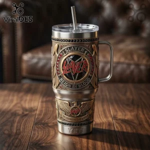 Slayer band insulated steel tumbler with embossed Reign in Blood and Seasons in the Abyss graphics on a wooden table.!