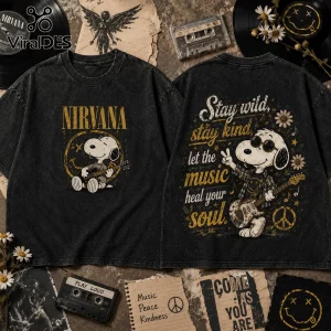 Black vintage-wash t-shirt with Snoopy playing guitar, Nirvana logo, and Stay Wild Stay Kind text in yellow and white.!