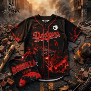 Black LA Dodgers baseball jersey featuring Godzilla graphics, red fire accents, and Japanese text on a ruined city street.!