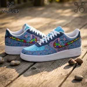 Custom blue Nike Air Force 1 sneakers featuring Stitch, puzzle piece patterns, and infinity symbols on a wooden surface.!