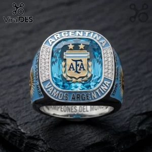 Argentina football championship ring featuring a blue central gem, AFA logo, two gold stars, and VAMOS ARGENTINA text.!