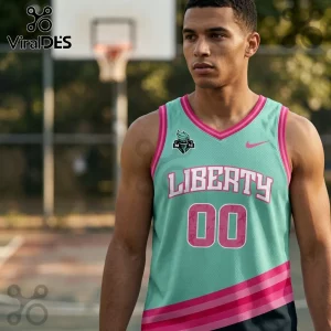 Man wearing a teal and pink New York Liberty basketball jersey with number 00, standing on an outdoor court.!