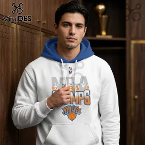 Man wearing a white New York Knicks 2026 NBA Champions hoodie with a blue hood and orange and blue team logo.!