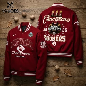 Maroon wool varsity jacket with Oklahoma Sooners 2026 College World Series graphics and embroidery on wood background.!