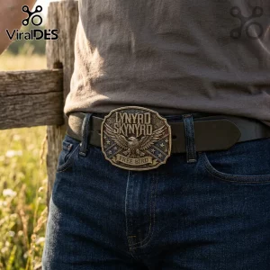 Lynyrd Skynyrd brass-tone belt buckle featuring an eagle, stars, and Free Bird text on a black leather belt.!