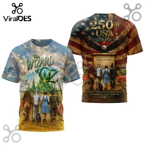 Wizard of Oz t-shirt features Dorothy, Tin Man, Lion, and Scarecrow on a yellow brick road under a US flag and 250th text.!