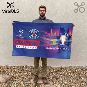 Man holding a blue Paris Saint-Germain Champions of Europe Budapest 26 Final flag featuring the UEFA Champions League logo.!