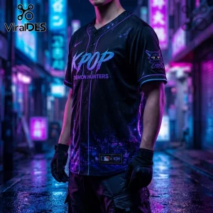 Black button-up jersey featuring KPOP DEMON HUNTERS text, purple neon graphics, and sleeve mascot in a city alleyway.!