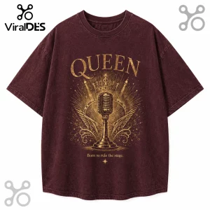 Maroon vintage wash t-shirt featuring gold Queen logo, a central microphone with wings, crown, and text Born to rule the stage.!