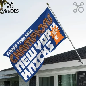 Blue New York Knicks flag featuring orange text reading Three Time NBA Champions and a stylized Statue of Liberty logo.!