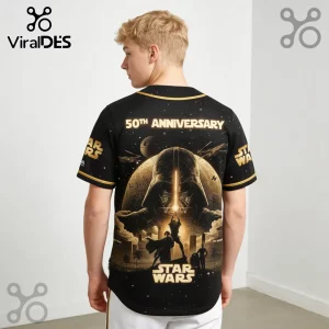 Black Star Wars 50th anniversary baseball jersey featuring a gold Darth Vader graphic, space scene, and logo on back.!