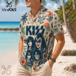 Man wearing a cream-colored short-sleeve button-up shirt featuring KISS band graphics, palm trees, and tropical flowers.!