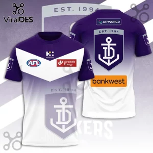 Fremantle Dockers AFL jersey featuring purple and white gradient, anchor team logo, and sponsor patches on fabric.!