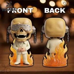Vinyl figure of a skull-headed character in a beige tuxedo with silver goggles and chains standing in orange flames.!