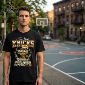 Black cotton t-shirt with metallic gold New York Knicks 2026 NBA Finals Champions graphic on an outdoor basketball court.!