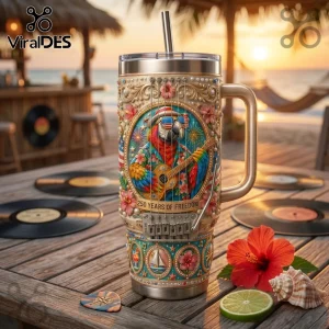 Stainless steel tumbler featuring a parrot with guitar, American flag sunglasses, and text 250 YEARS OF FREEDOM on wood table.!