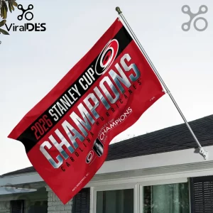Carolina Hurricanes 2026 Stanley Cup Champions red and black fabric house flag mounted on a silver pole against the sky.!
