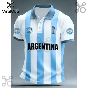 Argentina polo shirt with white and sky blue vertical stripes, 2026 World Cup logo, and black text against gray background.!
