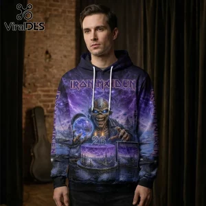 Man wearing an Iron Maiden hoodie with purple Eddie artwork, a birthday cake with the number 26, and dark sky background.!