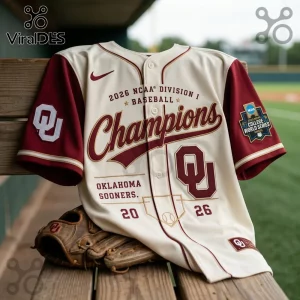 Oklahoma Sooners 2026 NCAA Division I Baseball Champions cream and crimson button-up jersey draped over a baseball glove.!