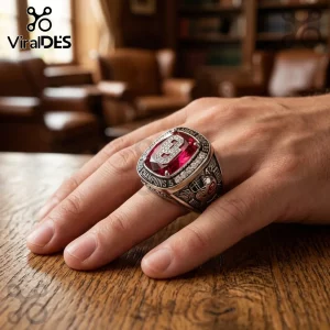 Oklahoma Sooners championship ring with a large red center stone and silver metal details worn on a finger.!
