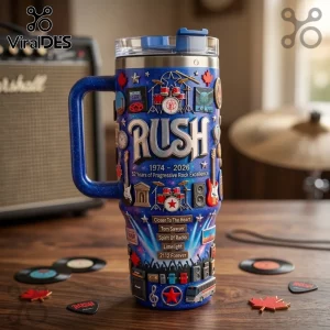Blue glitter insulated tumbler featuring Rush band logo, drum kits, guitars, and lyrics on a wooden desk with mini records.!