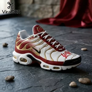 Slayer branded sneaker in white, gold, and burgundy with visible black swoosh and Slayer logo on tongue and toe box.!