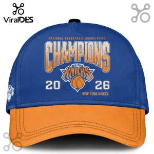 New York Knicks royal blue baseball cap with orange brim featuring Champions 2026 text and team basketball logo.!