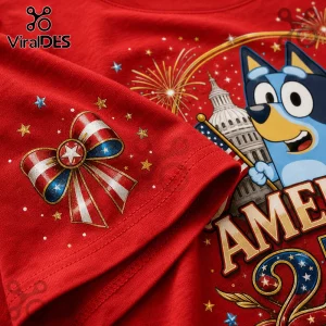 Bluey cartoon character with red white and blue patriotic bow on a red cotton t-shirt featuring US capitol graphics.!