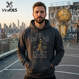 Man wearing charcoal gray hoodie with New York Knicks 2026 NBA Champions graphic and Larry O'Brien trophy illustration.!