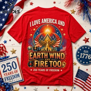 Red graphic t-shirt featuring a pyramid, wings, city skyline, vinyl records, and text reading I Love America and Earth Wind.!