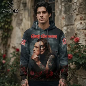 Man wearing a grey pullover hoodie with Ozzy Osbourne graphic, featuring a portrait holding a mask and red rose accents.!