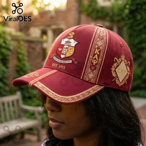 Maroon Kappa Alpha Psi baseball cap with embroidered fraternity crest, Greek letters, and gold geometric border details.!