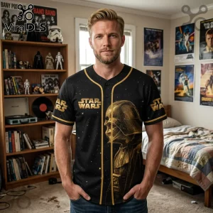 Black Star Wars baseball jersey featuring a gold Darth Vader helmet graphic and star pattern on a man.!
