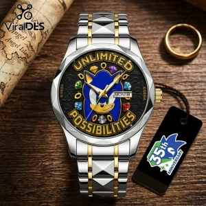 Sonic the Hedgehog stainless steel watch with gold accents, day-date dial, and colored gem markers on wooden surface.!