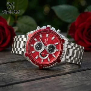 Silver chronograph watch with red dial, tachymeter bezel, crystal accents, and stainless steel band on wooden surface.!