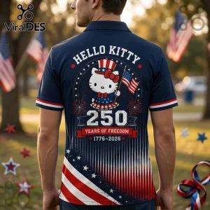 Navy blue polo shirt with Hello Kitty graphic, American flag details, and 250 years of freedom 1776-2026 text on back.!