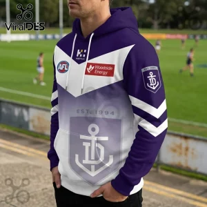Fremantle Dockers AFL hoodie in purple and white with Woodside Energy logo, anchor emblem, and Est. 1994 text.!