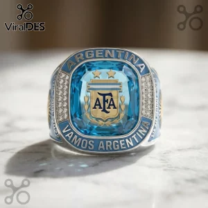 Argentina AFA championship ring with light blue crystal, gold crest, and text reading ARGENTINA and VAMOS ARGENTINA.!