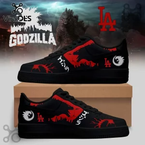 Black sneakers featuring red Godzilla silhouettes, white Japanese text, and Los Angeles Dodgers logo on a cardboard box.!