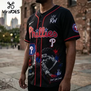 Black Philadelphia Phillies baseball jersey with red piping, custom graphic of a praying man, and Phillies team logos.!