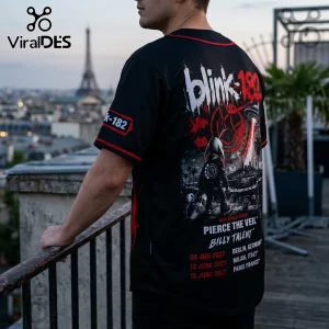 Black Blink-182 baseball jersey with red trim, featuring back graphics of a bunny, UFO, and 2027 concert tour dates.!