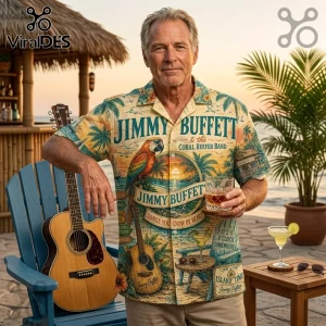 Man wearing a yellow tropical Jimmy Buffett print button-down shirt holding a whiskey glass next to an acoustic guitar.!
