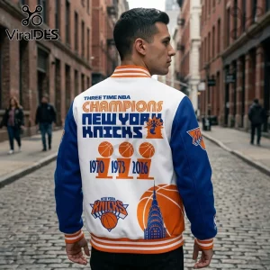 White and blue New York Knicks varsity jacket with orange trim, featuring 1970, 1973, and 2026 championship graphics.!