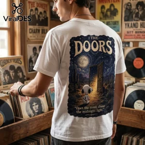 White t-shirt featuring a Snoopy illustration, The Doors logo, and desert night graphic with text about midnight light.!