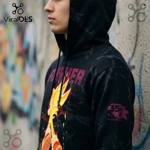 Black hoodie with Super Sonic graphic and 35th anniversary sleeve print worn by a man against a graffiti wall.!