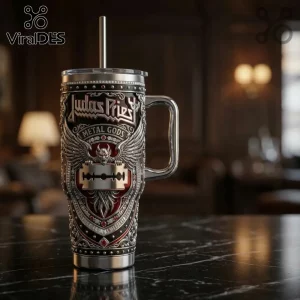 Judas Priest Metal Gods stainless steel tumbler with winged razor blade emblem and red accents on a marble table.!