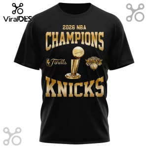 Black t-shirt featuring 2026 NBA Champions graphics with a gold Larry O'Brien trophy and New York Knicks team logo.!